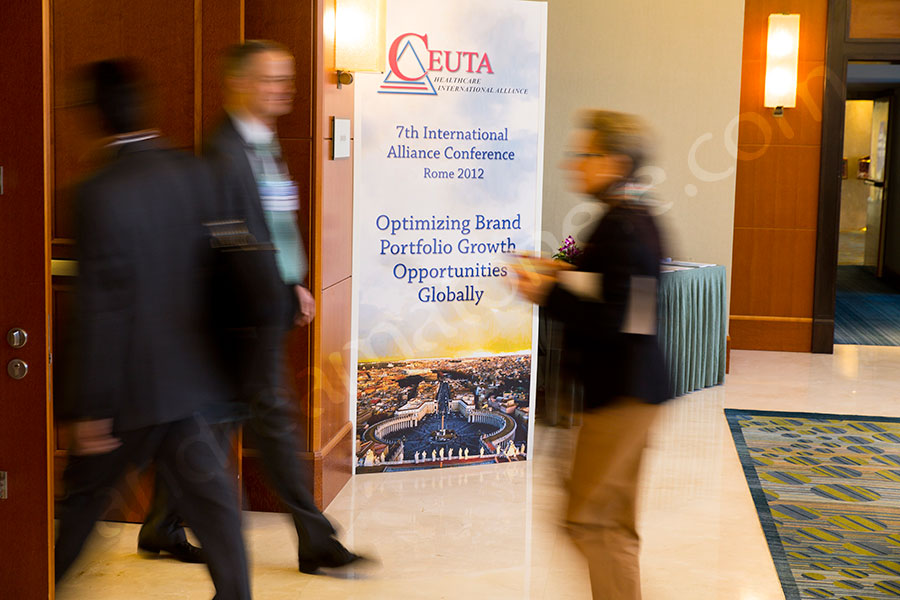 Business people walking by during the conference