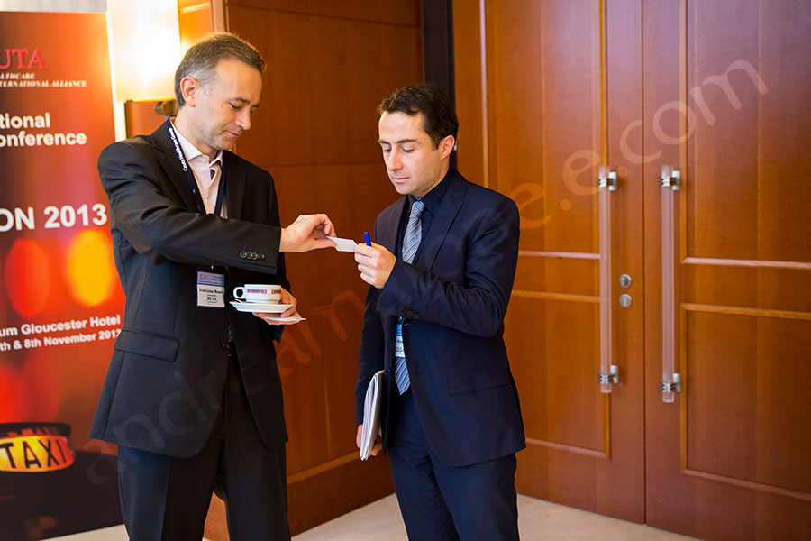 Exchanging business cards during break