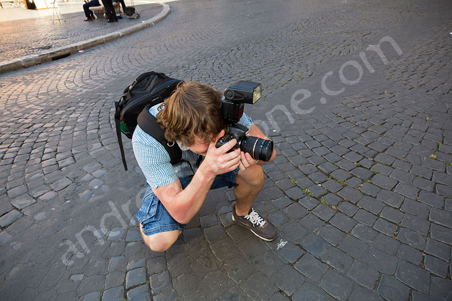 Photographer taking a picture during a photo tour in Rome