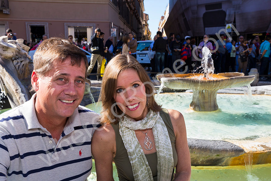 Couple photographed at the fountain in the Spanish steps in Rome