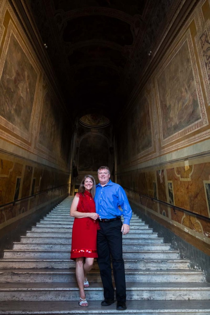 Couple standing on the side steps of the Scala Santa