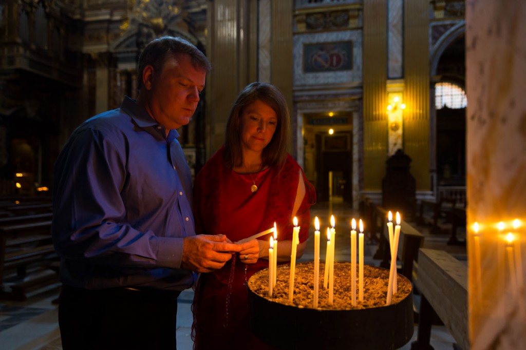 Church of Jesus inside. Lighting up candles.