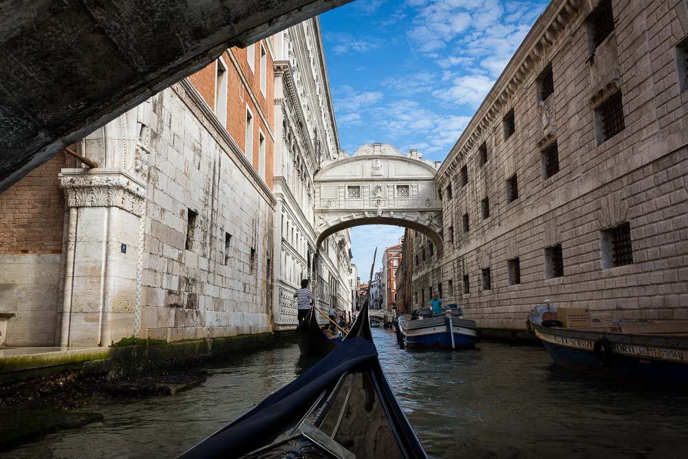 Gondola ride navigating underneath Ponte dei Sospiri in Venice