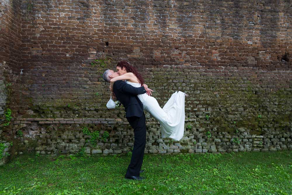 The groom picks up the bride.