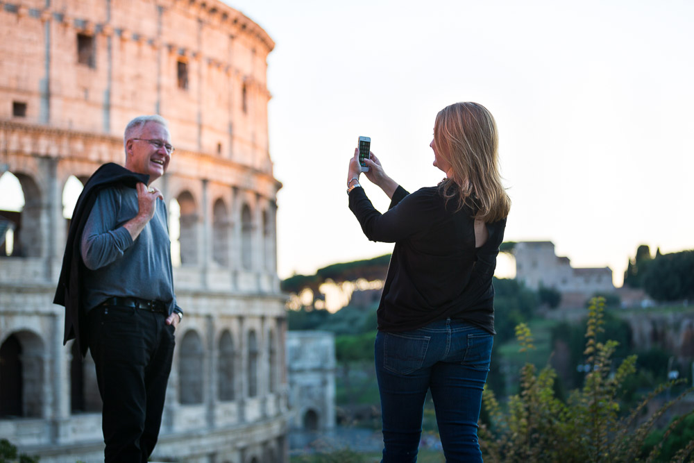 Taking a holiday picture with the Coliseum in the back. 