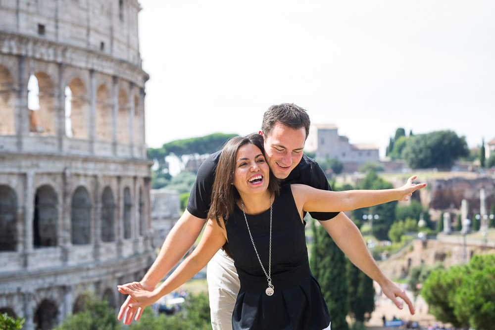 Having fun and enjoying the view over the Colosseum. Rome vacation photographer.