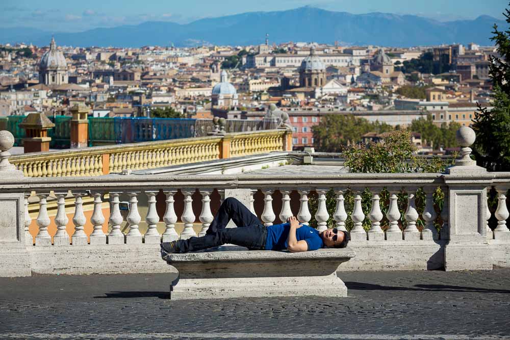 Laying down on a marble bench at the Gianicolo hill.