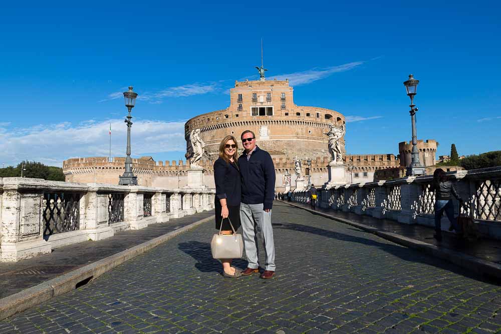 Standing on top of Castel Sant'Angelo bridge during a photo tour