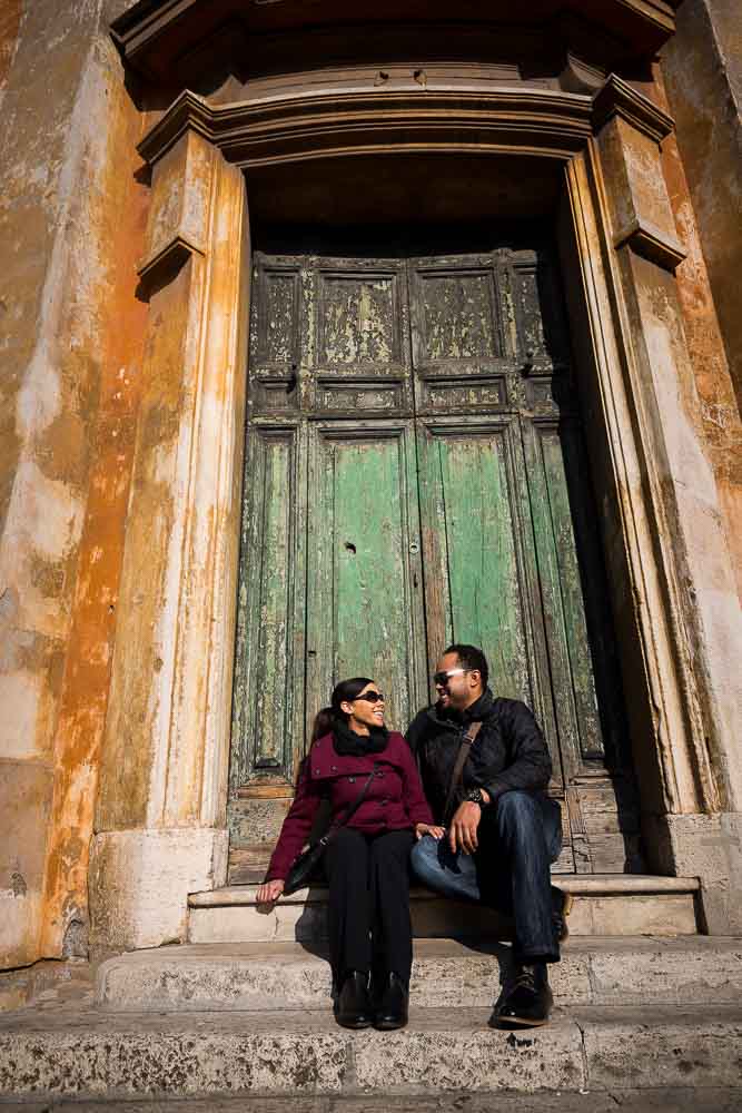 Picture taking in front of a green door