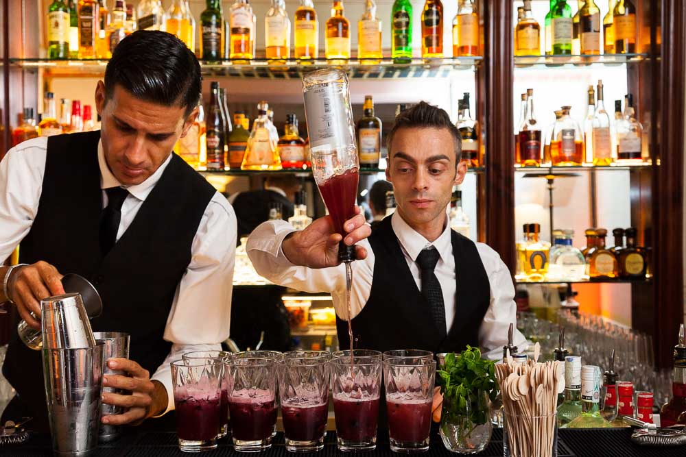 Bar tender preparing drinks for a party