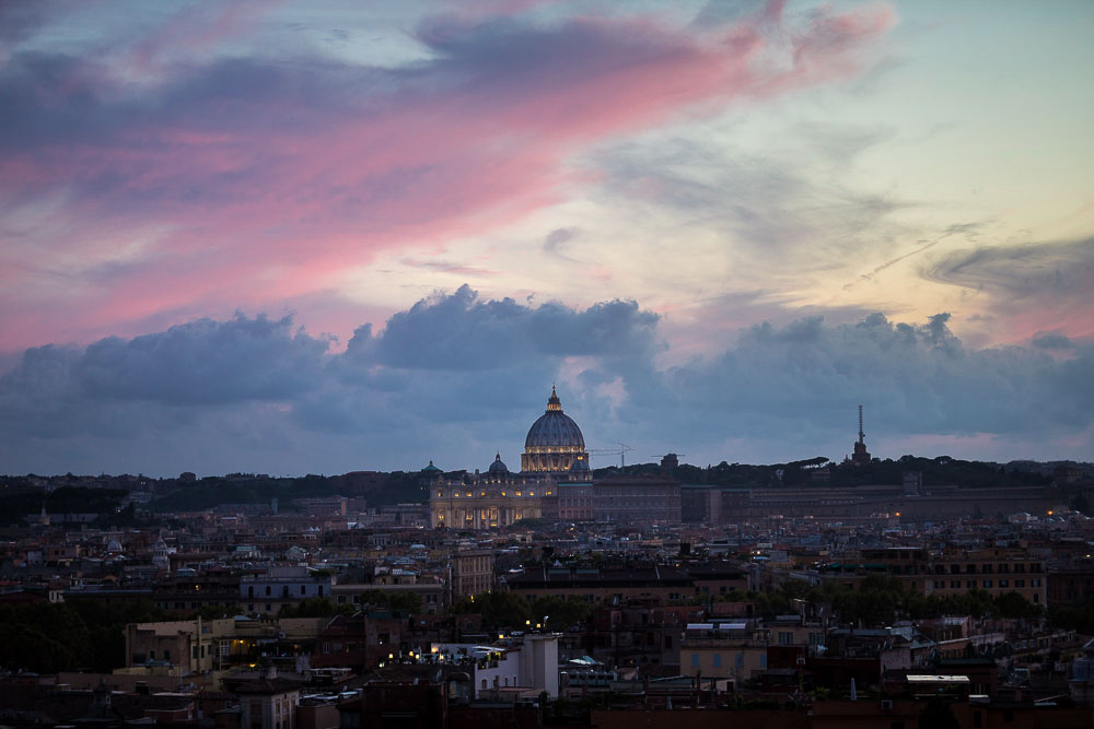 Travel photography of Rome Italy seen from above at sunset. Rooftop view. Panoramic and scenic view.