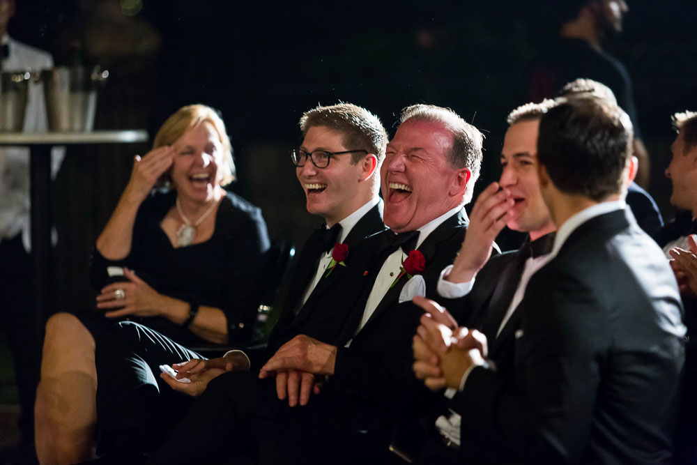 Guests laughing and enjoying the comedian