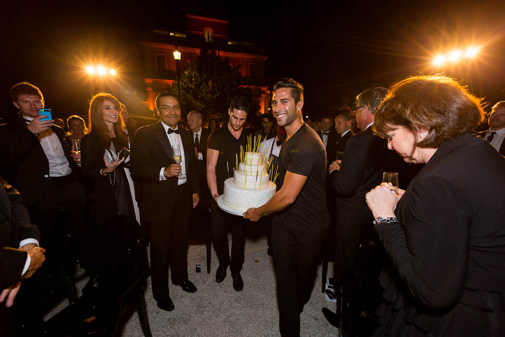 The wedding cake being brought up to the stage