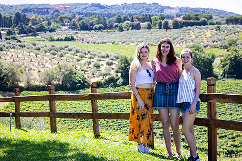 Guests posing for a group picture before the castelli romani vineyard countryside in around the town of Frascati Italy at a Frescati wine tour